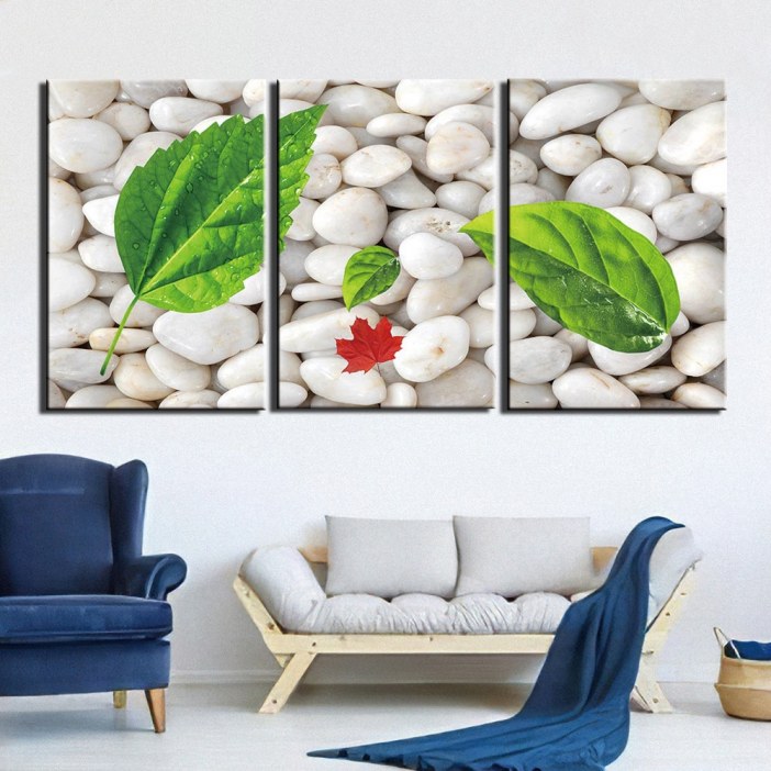 Tableau galets blancs et feuilles vertes